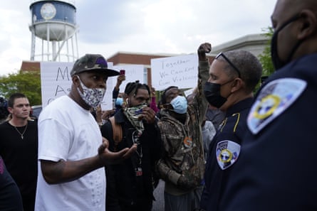 Demonstrators speak with the Elizabeth City police chief, Eddie M Buffaloe Jr, after Andrew Brown was shot by a Pasquotank county sheriff’s deputy on 21 April.