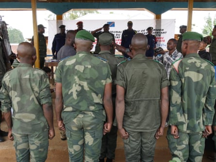 Men are tried for rape by a military judge in a mobile court in Oicha, Beni.