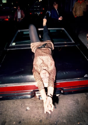 Woman reclining on car, 1977