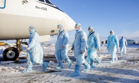 Chelyabinsk Airport employees in Russia take part in an exercise to evacuate aircraft passengers showing symptoms of coronavirus.