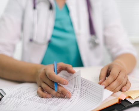 Close up of woman writing prescription