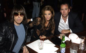 Johnny Ramone, Lisa Marie Presley and Nicolas Cage at a table