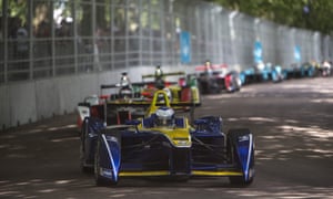 Formula E cars race through Battersea Park in London in July 2016.