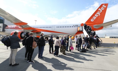 Passengers prepare to board an easyJet flight at Gatwick airport in West Sussex.