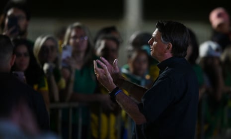Brazilian President and re-election candidate Jair Bolsonaro speaks to supporters after learning the results of the legislative and presidential election in Brasilia, on 2 October 2022.