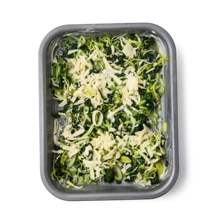 Felicity Cloake’s strata – leek, spinach and grated cheese in a pan