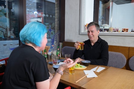 Cushla and Martin chat across a restaurant table