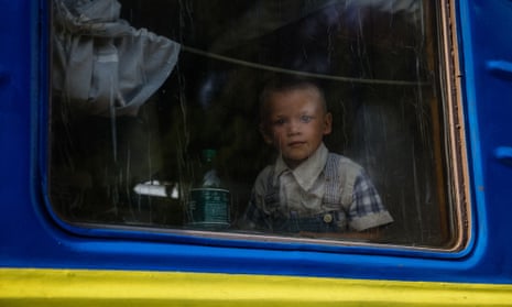 A child looks out of the window on an evacuation train from Donbas region to the west of Ukraine.