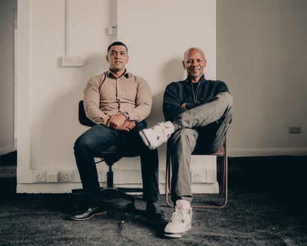 Giggs (right) and OMG Education CEO Jamal Miah sitting next to each other in the under-construction St James House school