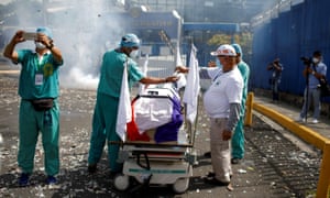 Members of the Salvadoran Social Security Institute workers’ union gather around an empty coffin as they participate in a protest asking for quarantine measures to contain the spread of coronavirus in San Salvador, El Salvador 16 July 2020.