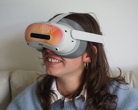 A girl smiling from behind a Phase Space-branded headset