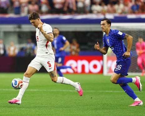 John Stones in action with Croatia's Petar Musa.