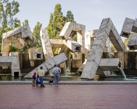 people looking at a fountain