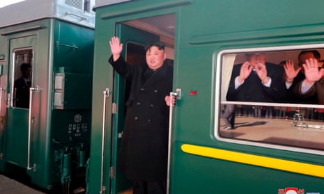 Kim Jong-un waves before setting off for Russia on his armoured train.