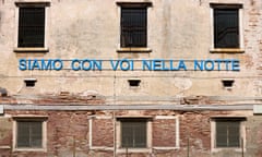 Slogan that translates as ‘we are with you in the night’ on a wall at Giudecca women’s prison in Venice