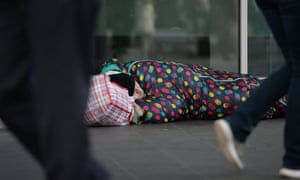 a man sleeps on the street