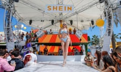 A model walks the runway at a Shein fashion show and pop-up shop in Ibiza