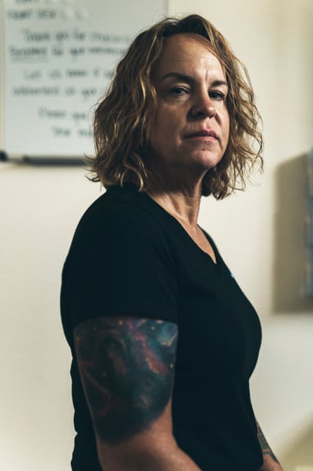 A woman poses in a medical clinic