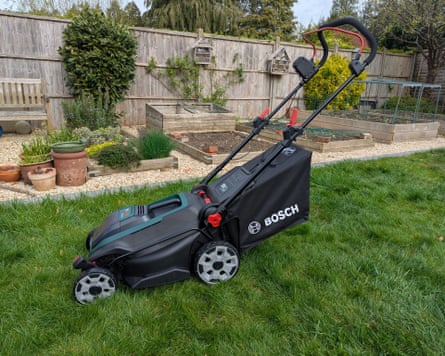A Bosch Rotak lawnmower in the garden.