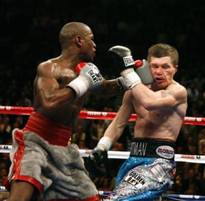 Floyd Mayweather Jr lands a left on Ricky Hatton (right) during the WBC welterweight title fight in December 2007.