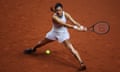 Emma Raducanu stretches for a backhand on a clay court at the Porsche Arena in Stuttgart