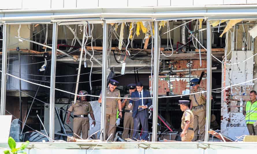 Officials inspect the damage at the Kingsbury Hotel after the attack.