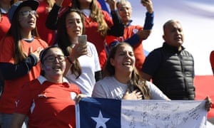 Chilean fans sing their national anthem.