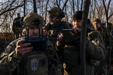 Members of Ukraine’s 63rd Mechanised Brigade operate a drone near Snihorivka.