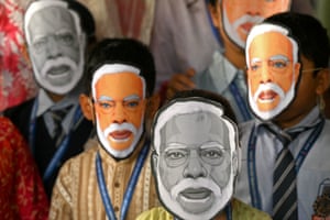 Students wear masks of Narendra Modi