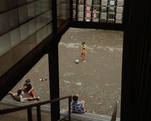 children sit and play outside in patio area