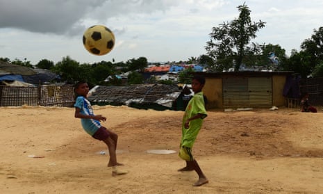 Rohingya refugee children play football at the Kutupalong refugee camp in Ukhia. 