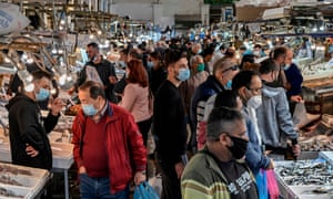 People, wearing face masks, shop at the Athens central market on November 5, 2020.