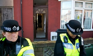 Police outside the house they searched in Luton.