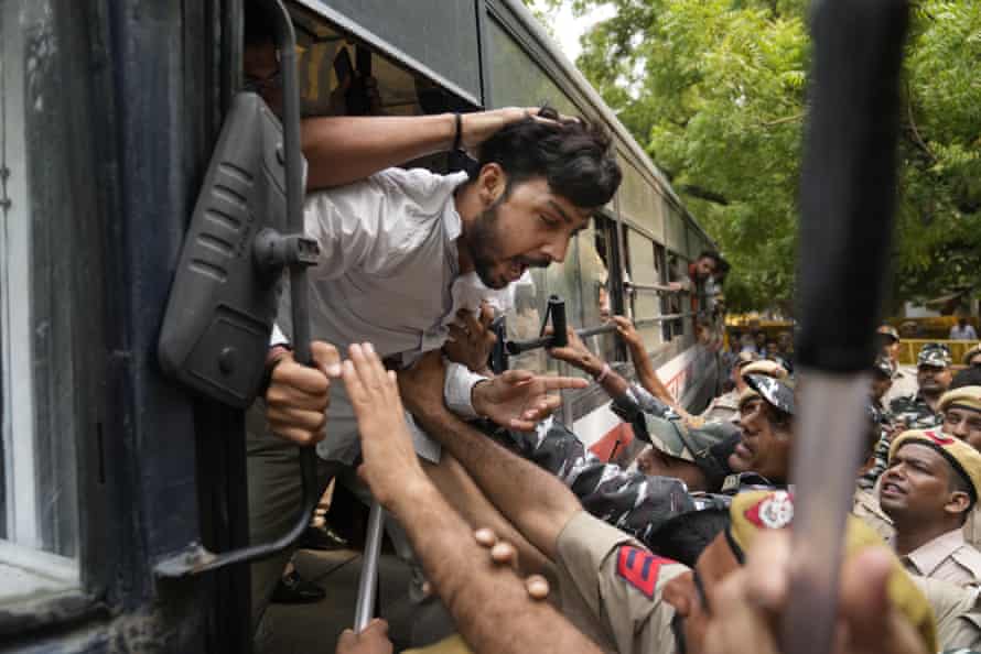 Policemen in New Delhi detain activists from rightwing Hindu parties protesting against the killing of Kanhaiya Lal.