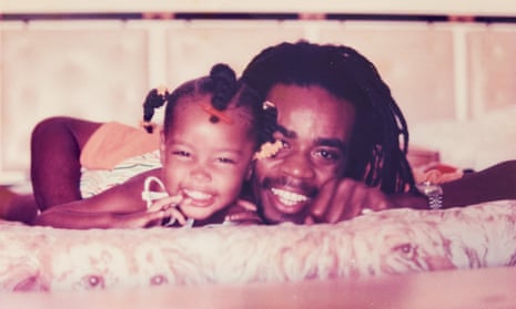 Safiya Sinclair, aged two, with her father, Djani, aged 24, at White House village in Montego Bay, Jamaica.