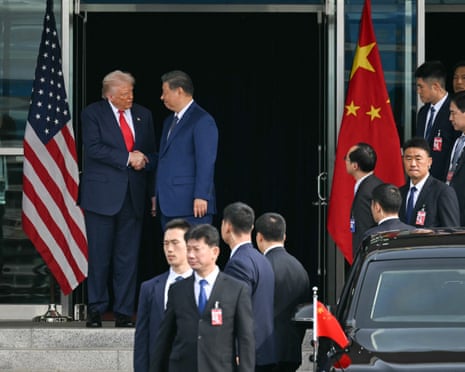 Trump and Xi shake hands as they leave after their talks at Gimhae air base in Busan, South Korea, on Thursday