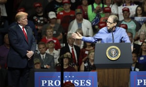 The Indiana Republican senatorial candidate Mike Braun, right, acknowledges Donald Trump during a Republican campaign rally this week in Elkhart.