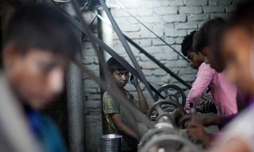 Boys at lathes turning aluminium pots