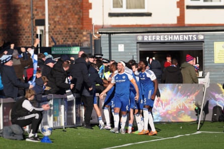 Macc celebrate with Palace fans in the refreshments queue
