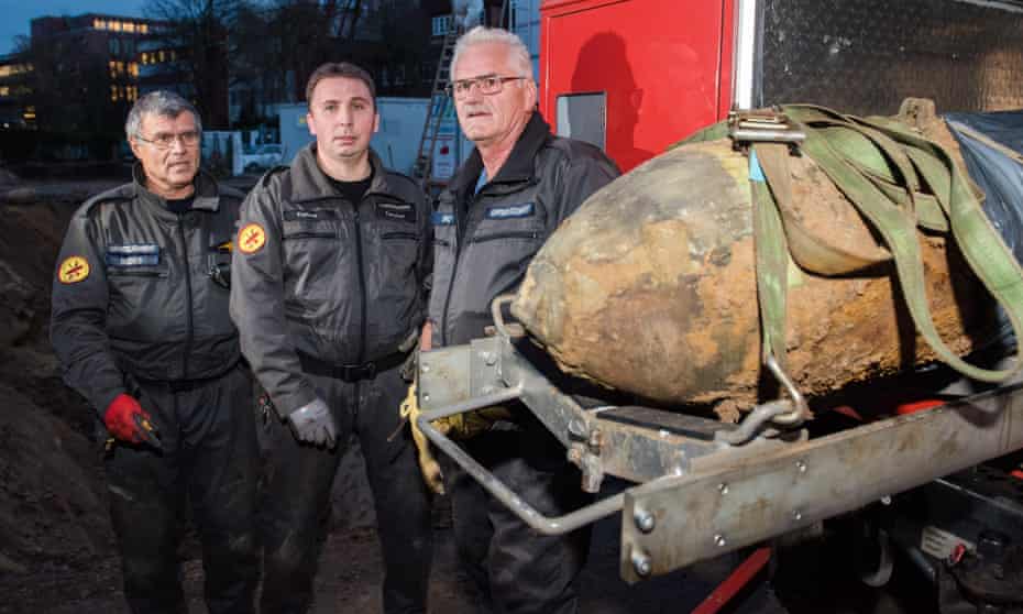 Ordnance survey … Peter Bodes, Joern Kalies and Wilfried Krenz of Hamburg’s bomb disposal unit with a defused second world war explosive.