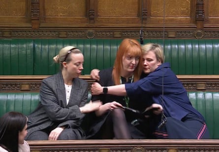 Charlotte Nichols being comforted by other MPs in the Commons after describing her experiences.