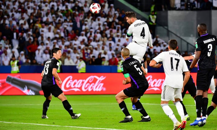 Real Madrid’s Spanish defender Sergio Ramos (number 4) heads the ball and scores.