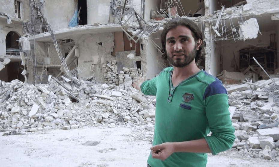 Teacher Abdulkafi Alhamdo, in front of a bombed-out school in Aleppo