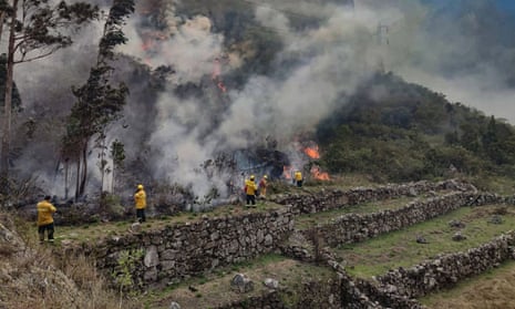 Firefighters put out a wildfire that threatened part of Machu Picchu in June. 