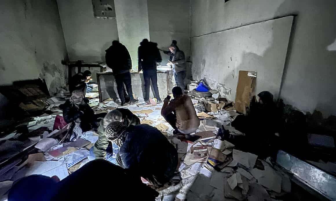 Teams looking for secret compartments in Sednaya prison on Monday.