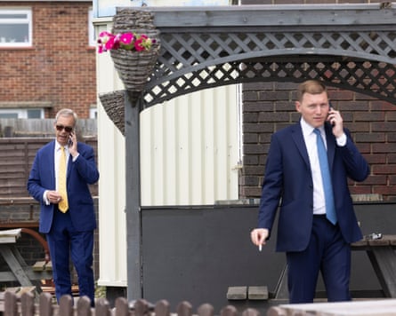 Nigel Farage and George Cottrell smoking outside a pub