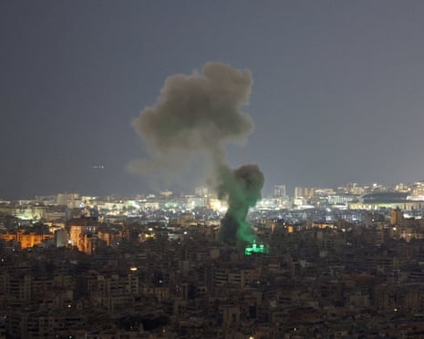 Plumes of smoke rise from buildings following an Israeli strike on Beirut's southern suburbs on Friday.