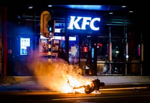 A motorcycle burns during the disturbances in Rotterdam on Monday night.