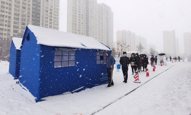 Residents line up at a makeshift nucleic acid testing site in Changchun, Jilin province, which has seen China’s first coronavirus deaths in over a year. 