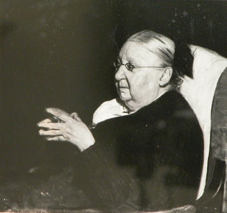 A photograph of a painting of Gertrude Jekyll by William Nicholson, in which she sits in late age with her hands held together